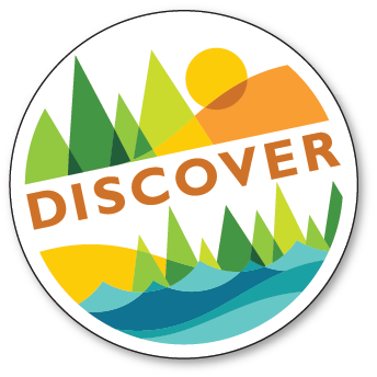 A circular logo with the word “DISCOVER” over abstract green trees, blue water, yellow land, and an orange sun in the background, symbolizing nature and adventure.