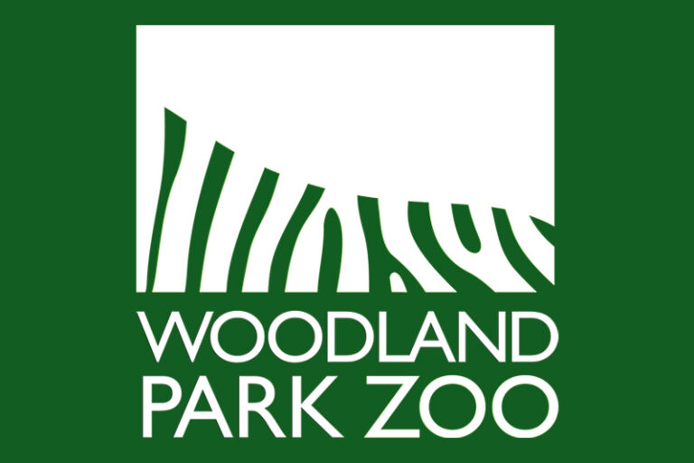 White logo with stylized zebra stripes forming a square shape above the words WOODLAND PARK ZOO in bold capital letters, all on a green background.